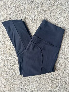 High-Waist Black Lululemon cropped Athletic Leggings with mesh side panels